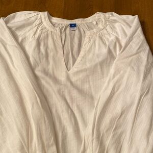 Beautiful cream colored long sleeve, V-neck top.